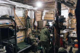 Soldiers from the 'Taifun' unmanned aerial vehicle unit are stationed in a dugout, where they live and carry out combat missions in Kharkiv